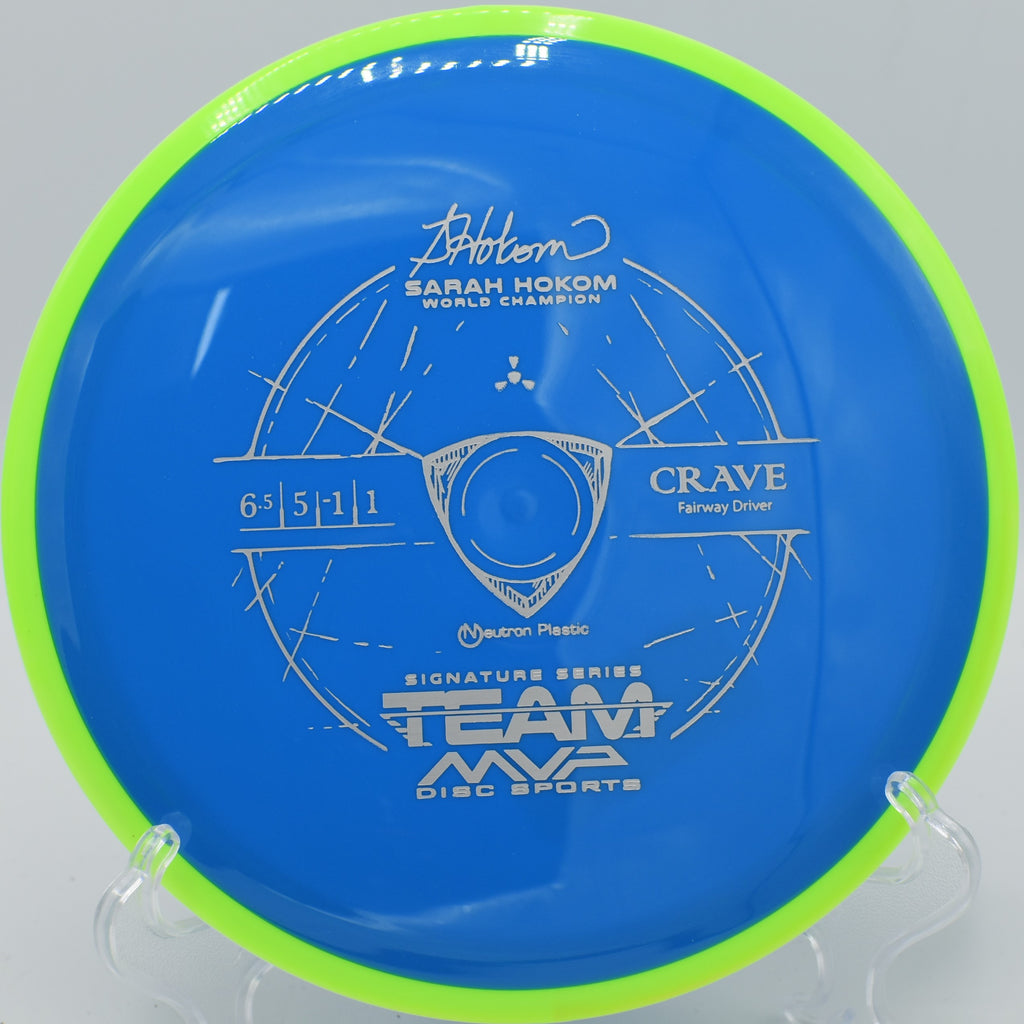 Action shot of a disc golf throw with the Neutron Crave mid-flight, captured at Maple Hill Disc Golf Course in Leicester, Massachusetts, demonstrating its stable, controlled distance and slight turn.
