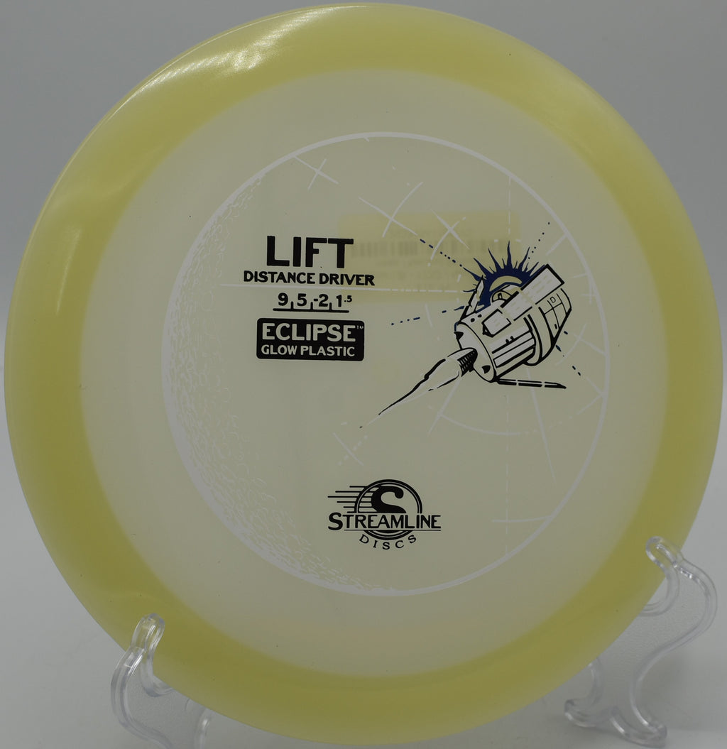 Eclipse Lift disc glowing brightly on the green at Tall Firs Disc Golf Course in Monroe, Washington.