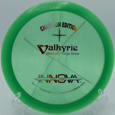 CE Valkyrie disc soaring over wooded fairways at Maple Hill Disc Golf Course, Leicester, Massachusetts.