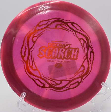 Discraft Z Swirl Scorch carving a perfect turnover shot on Hole 9 at Hidden Ridge Disc Golf Course, West Milford, New Jersey.