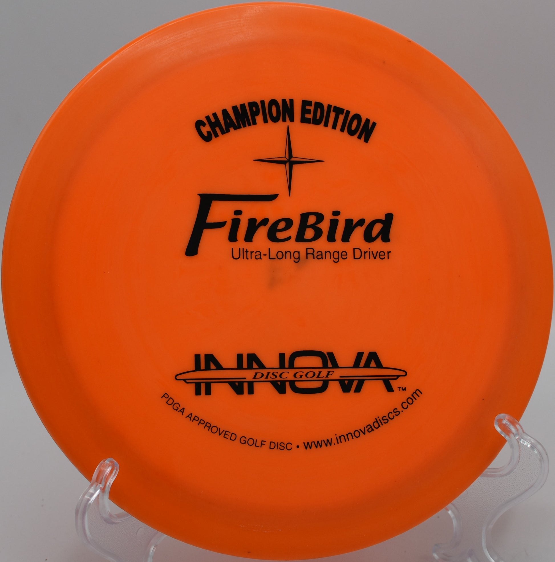 Rare CE Firebird disc displayed on the scenic fairways of Maple Hill Disc Golf Course, Leicester, Massachusetts.