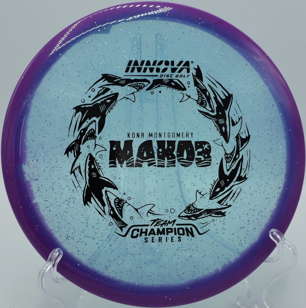 Metalflake Halo Champion Mako3 Kona Montgomery Tour Series 2026 midrange disc displayed at Maple Hill Disc Golf Course in Leicester, Massachusetts, built for laser-straight fairway approaches and controlled disc golf accuracy