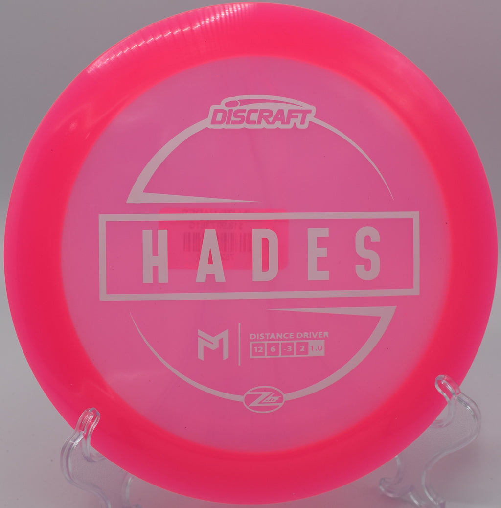 Z-Lite Hades by Discraft – 12-speed understable distance driver with a flight path of 12/6/-3/2, perfect for maximum glide and controlled finishes.