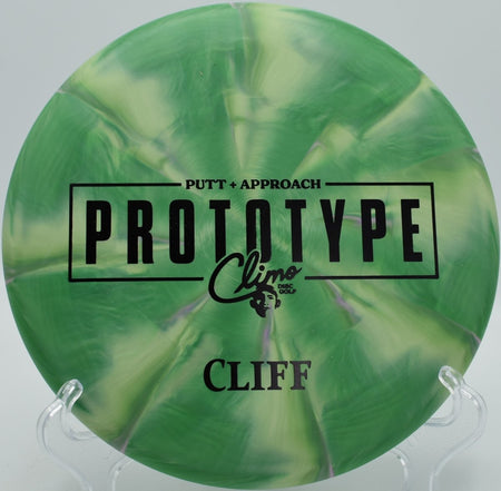 Prototype Trophy Line Cliff disc golf putter parked under basket at DeLaveaga Disc Golf Course in Santa Cruz, California wooded fairway