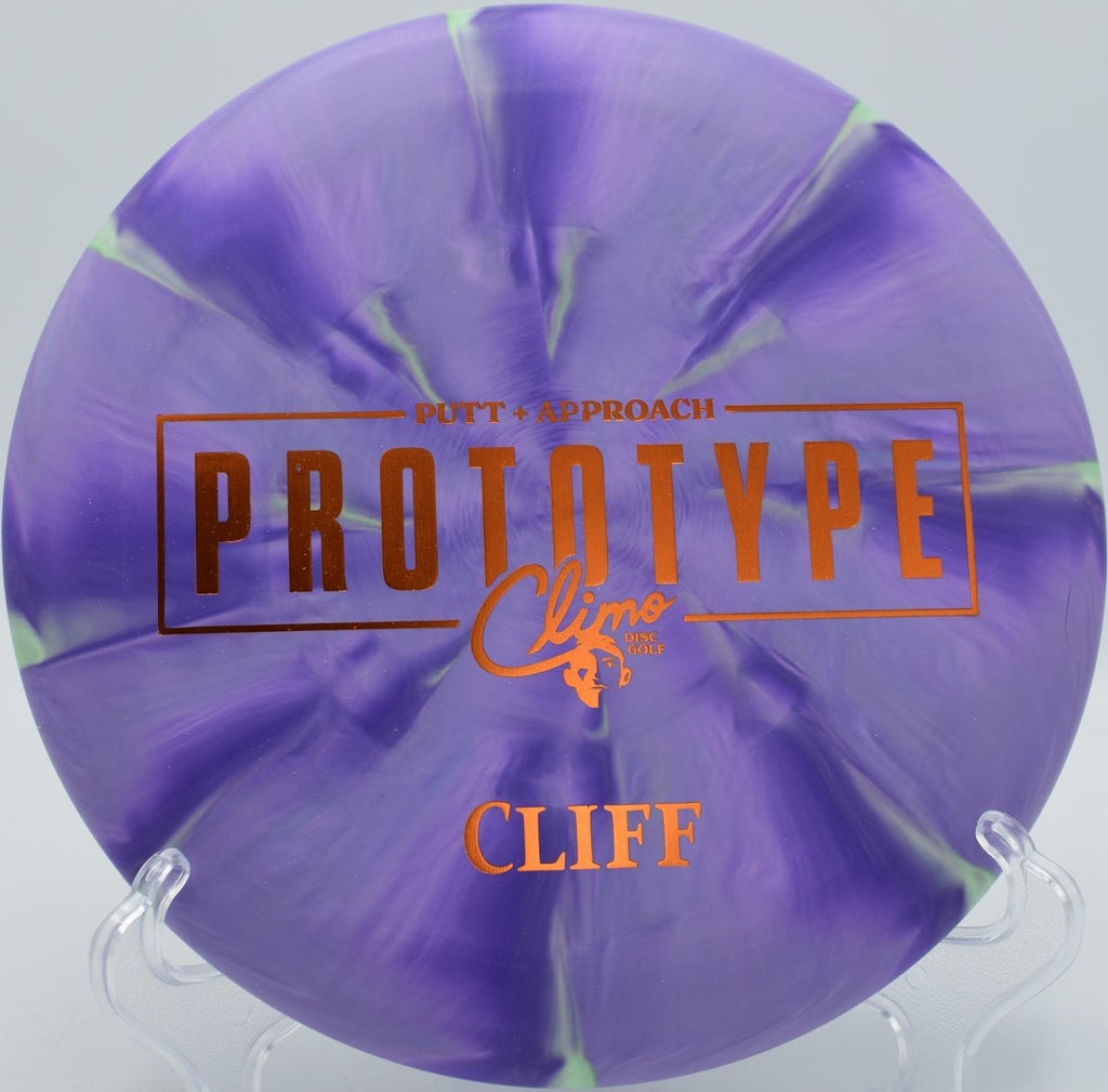 Beadless Cliff putter sitting under basket at The Rez Disc Golf Course in Brandon, Mississippi during approach shot