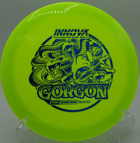 A disc golfer using a Star Gorgon for a controlled forehand drive at Beaver Ranch Disc Golf Course in Conifer, Colorado.