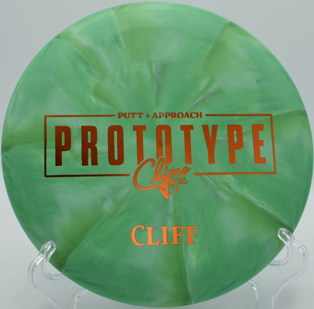 Prototype Trophy Line Cliff putter mid-flight at Rollin Ridge Disc Golf Course in Reedsville, Wisconsin wooded tunnel