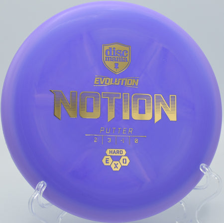 Exo Hard Notion floating straight with a touch of turn into the chains at Zephyrhills Disc Golf Course in Florida.

