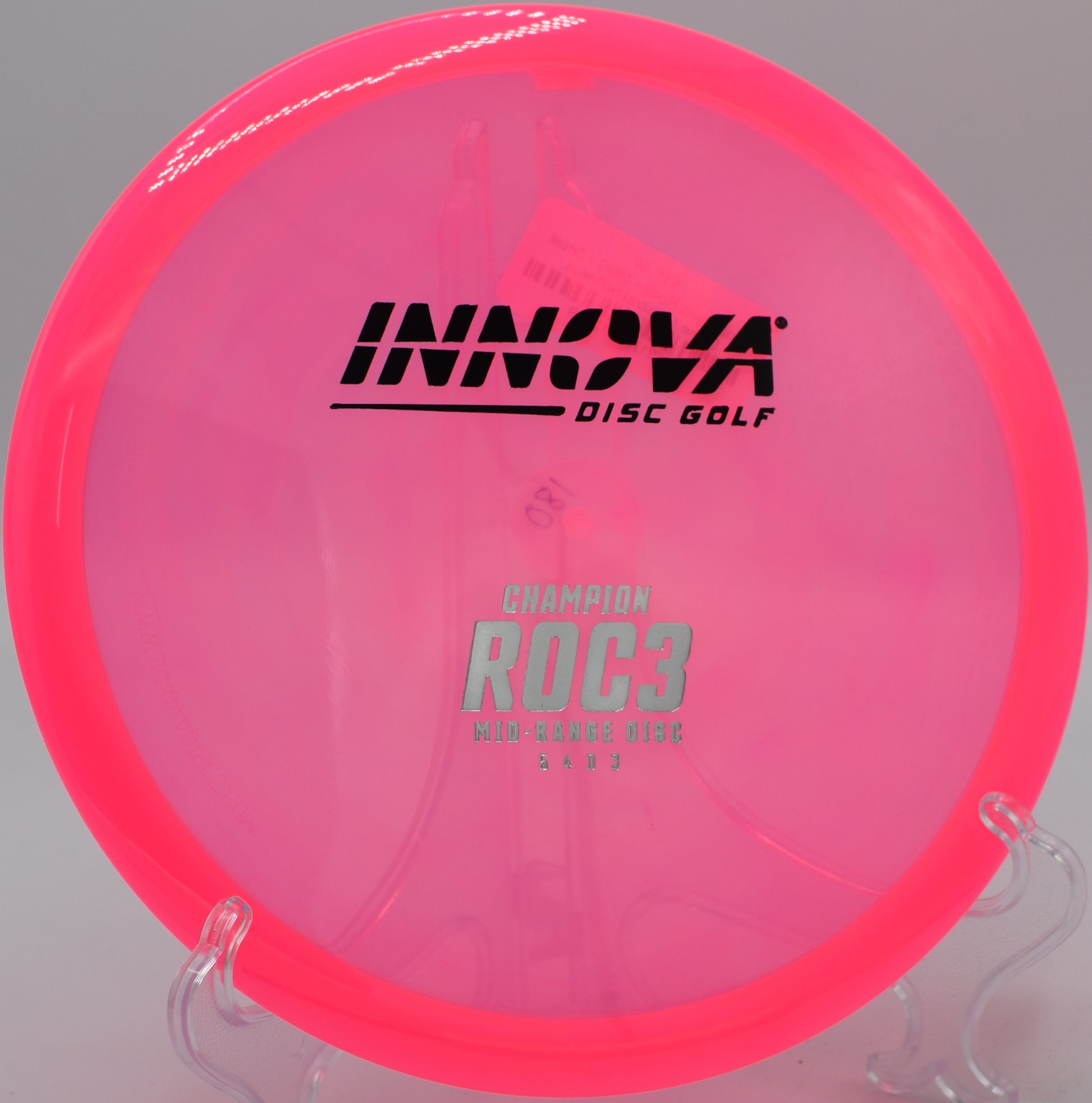 A player executing a standstill upshot with a Champion Roc3 at Harmony Bends Disc Golf Course in Columbia, Missouri.