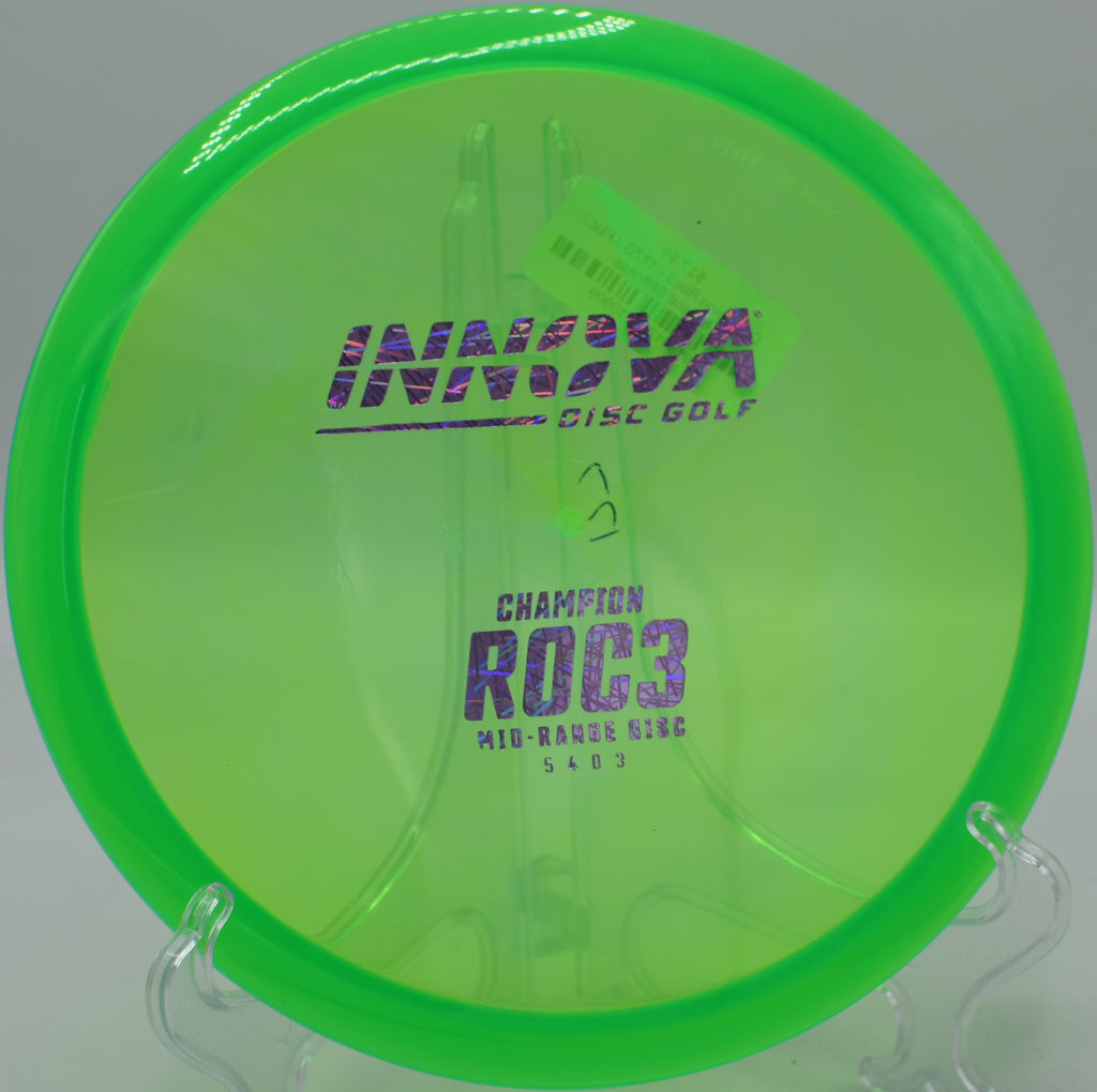 An Innova Champion Roc3 floating toward the basket at Cedar Hill Disc Golf Course in Nashville, Tennessee, after a controlled backhand approach.