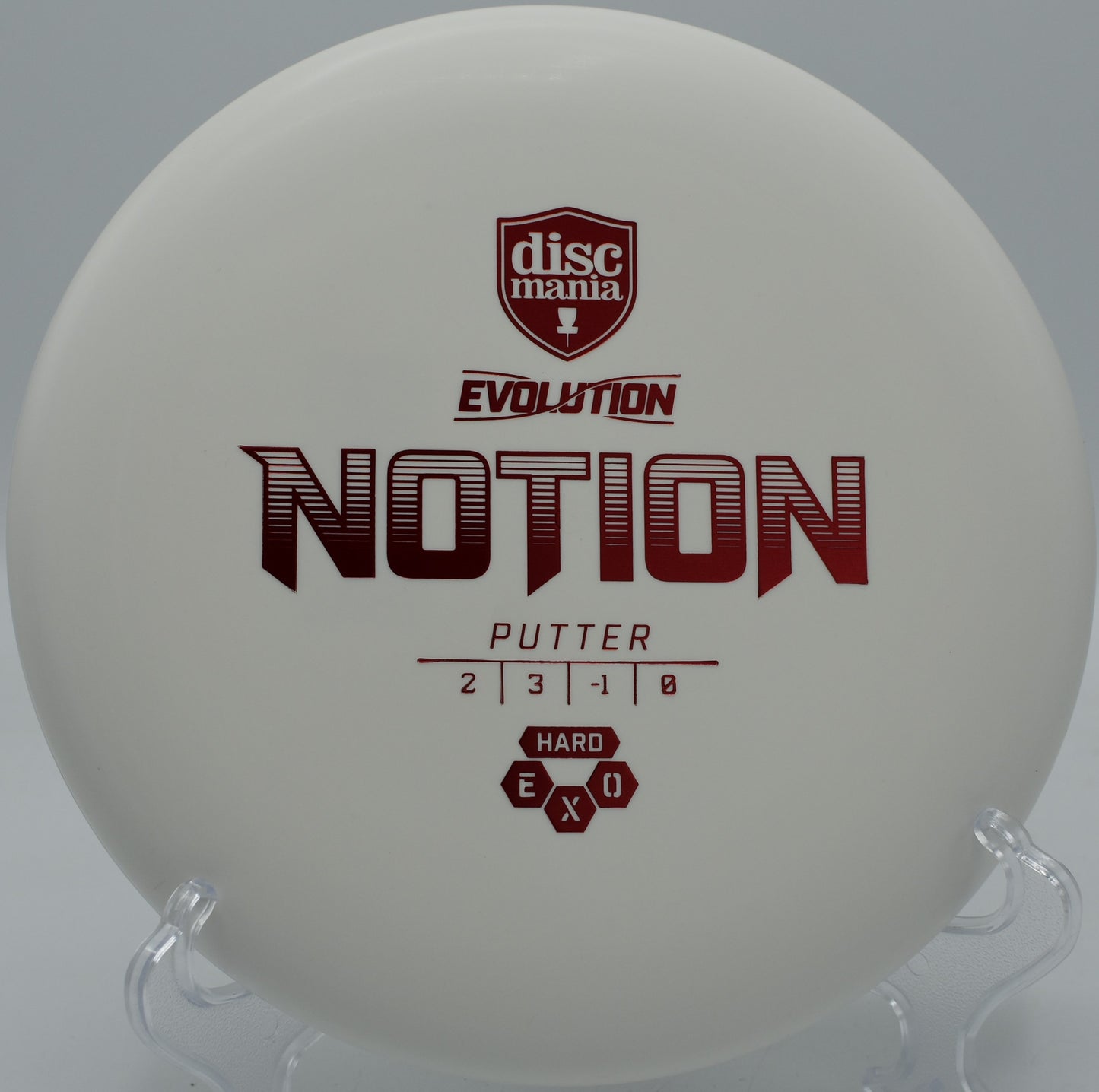 Exo Hard Notion floating straight with a touch of turn into the chains at SeaTac Disc Golf Course in Washington.

