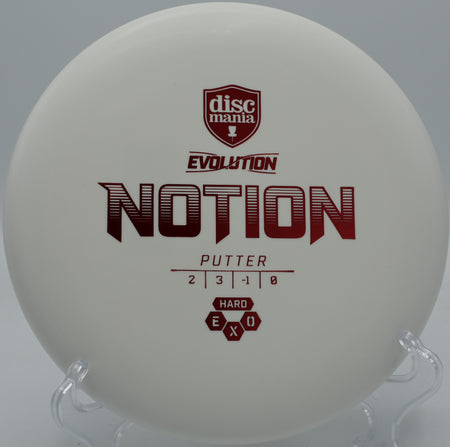 Exo Hard Notion floating straight with a touch of turn into the chains at SeaTac Disc Golf Course in Washington.

