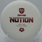 Exo Hard Notion floating straight with a touch of turn into the chains at SeaTac Disc Golf Course in Washington.

