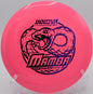 A player throwing a tailwind-assisted hyzer flip with a Star Mamba at Redbone Disc Golf Course in Texarkana, Arkansas.