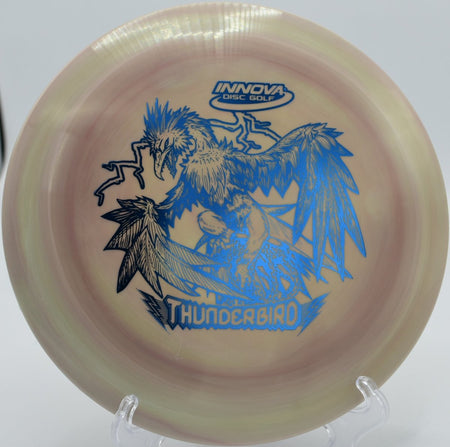 Swirly CRF Thunderbird fairway driver launched on a low, penetrating power line at Kayak Point Disc Golf Resort in Stanwood, Washington, emphasizing overstable control, torque resistance, flat Champion-style flight, and reliable fade for high-level disc golf tee shots