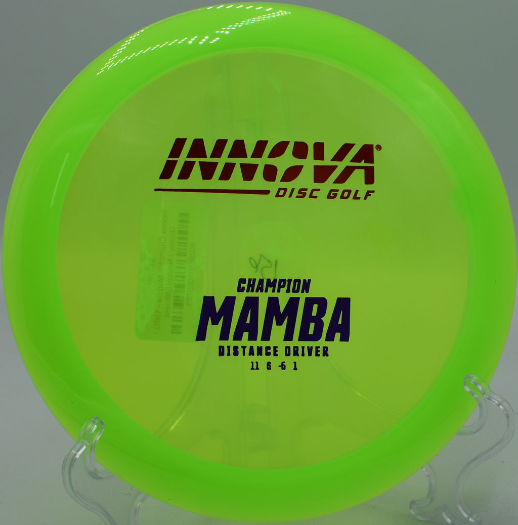 A player shaping a precise understable mid-range shot with a Champion Mamba at Harmon Hills Disc Golf Course in Fall Branch, Tennessee.