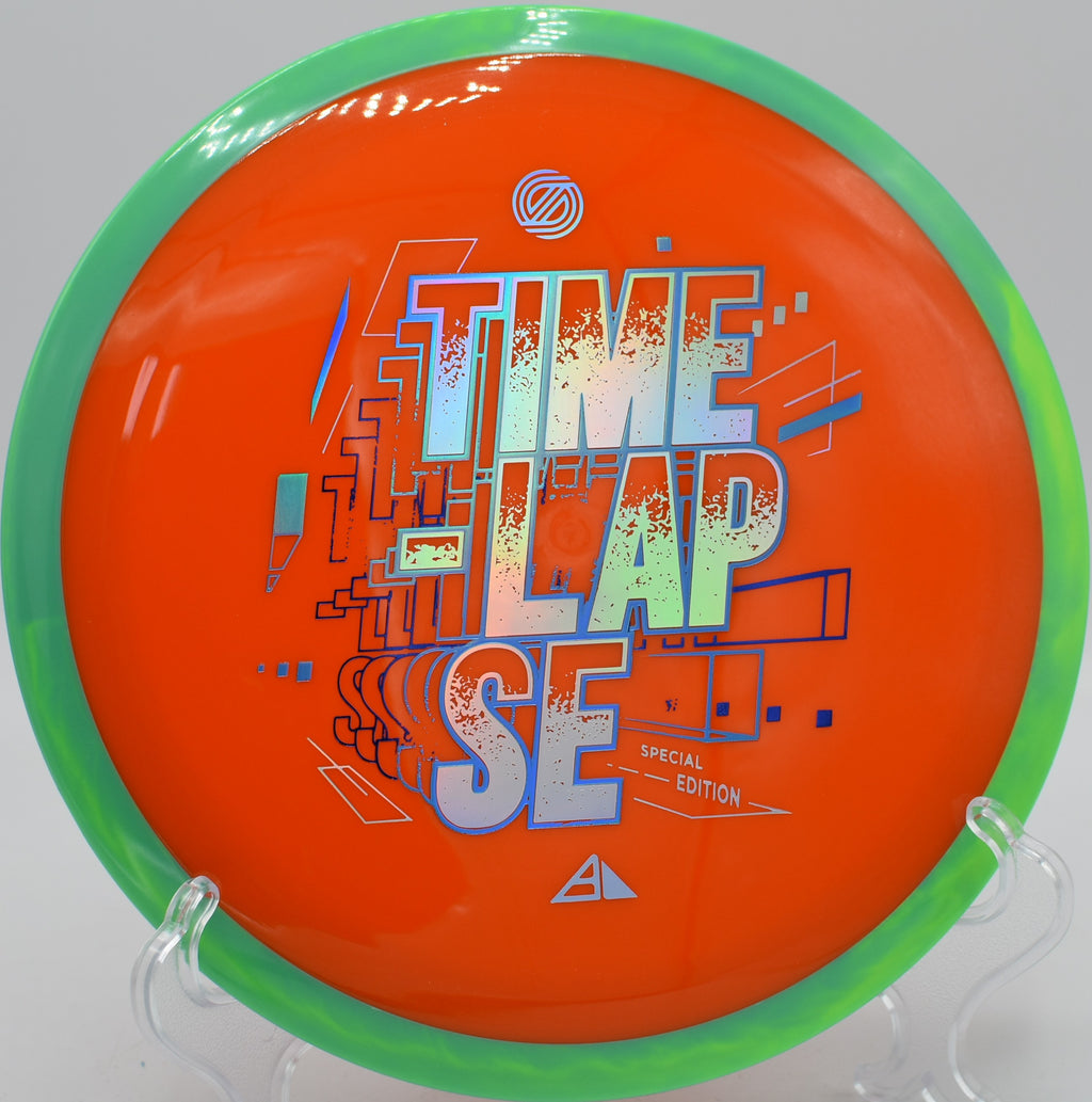 Axiom SE Time-Lapse Retooled mid-flight over wooded fairway at Flip City DGC in Shelby, Michigan

