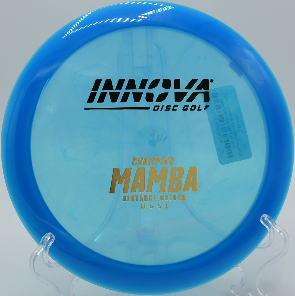 An Innova Champion Mamba smoothly fading to the right on a full flex shot at Brackett’s Bluff Disc Golf Course in Davidson, North Carolina.
