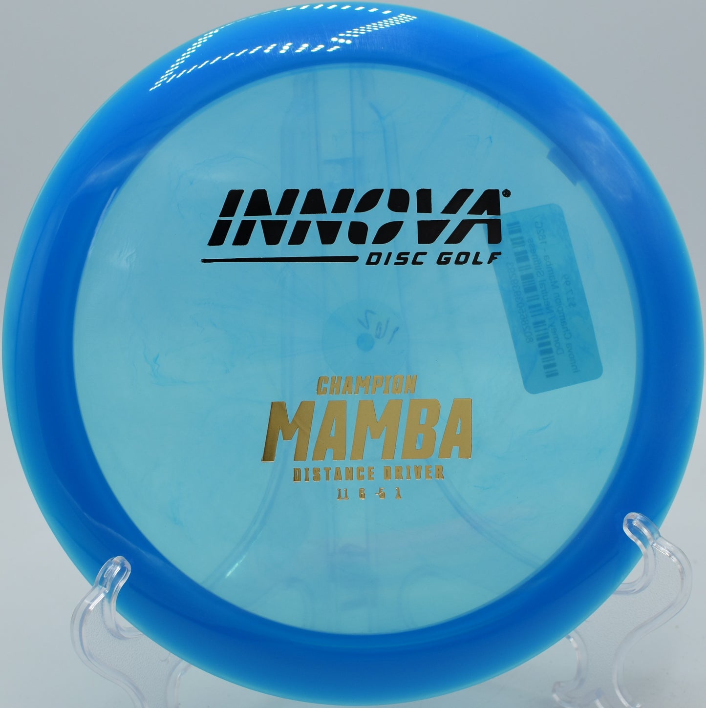 An Innova Champion Mamba smoothly fading to the right on a full flex shot at Brackett’s Bluff Disc Golf Course in Davidson, North Carolina.