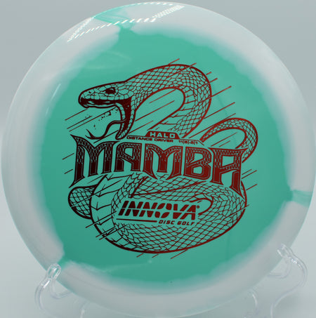 An Innova Halo Star Mamba smoothly flipping up in the mountain air at Bucksnort Disc Golf Course in Pine, Colorado.