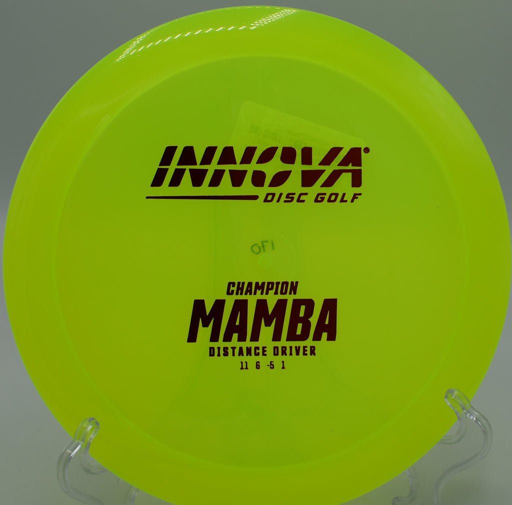 An Innova Champion Mamba cutting through the mountain air at Bucksnort Disc Golf Course in Pine, Colorado, displaying effortless turn and glide.
