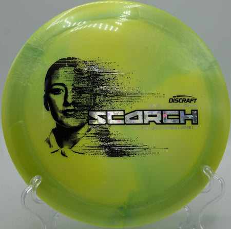 2026 Tour Series Scorch disc golf driver gliding through fairway at Milo McIver Disc Golf Course in Estacada, Oregon