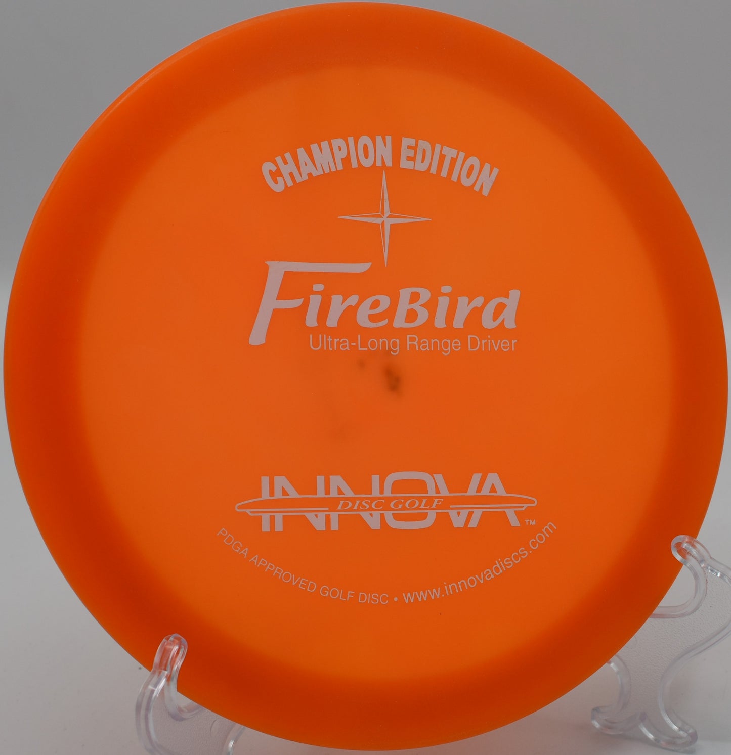 Champion Edition Firebird delivering a reliable fade on long hyzer shots at Harmony Bends Disc Golf Course, Missouri.