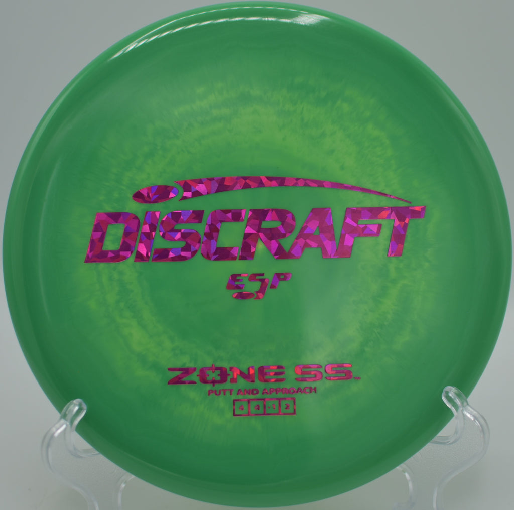 Discraft Zone SS tacky ESP upshot landing flat beside pin at Hornets Nest Disc Golf Course, Charlotte NC