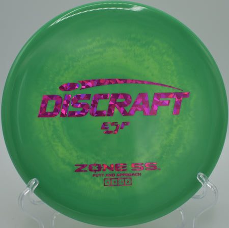 Discraft Zone SS tacky ESP upshot landing flat beside pin at Hornets Nest Disc Golf Course, Charlotte NC