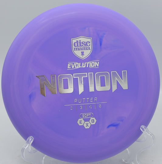 Exo Soft Notion disc lying on a rocky tee pad at DeLaveaga Disc Golf Course, Santa Cruz, California.