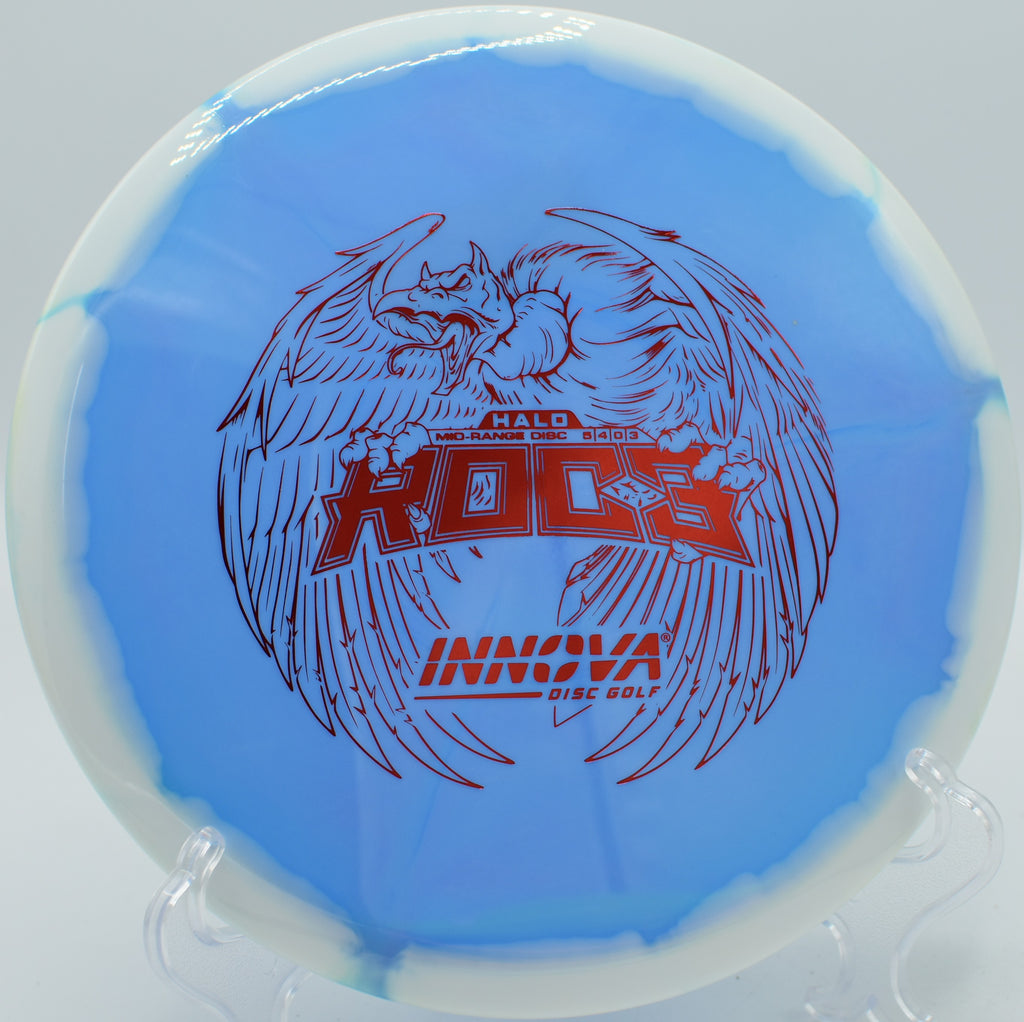 An Innova Halo Star Roc3 settling on the green at Stewart Pond Disc Golf Course in Eugene, Oregon, after a precise midrange shot.