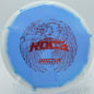 An Innova Halo Star Roc3 settling on the green at Stewart Pond Disc Golf Course in Eugene, Oregon, after a precise midrange shot.
