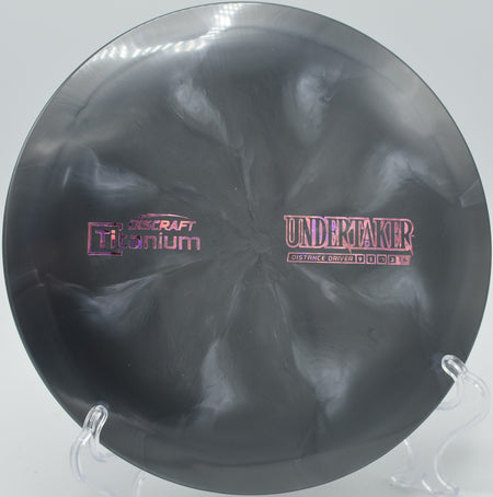 Titanium Undertaker – Overstable driver with a smooth fade, great for forehand throws, flex shots, and controlled long-range placements.