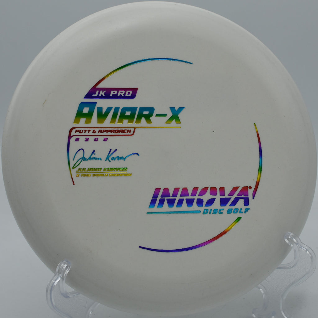 An Innova JK Pro Aviar floating toward the basket on a smooth anhyzer approach at Walnut Ridge Disc Golf Course in Clive, Iowa.