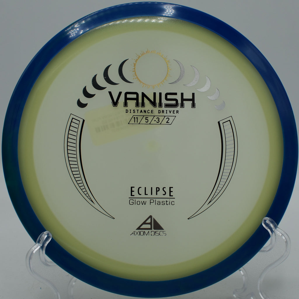Eclipse Vanish glowing mid-flight on a hyzerflip line at Maple Hill Disc Golf Course in Leicester, Massachusetts

