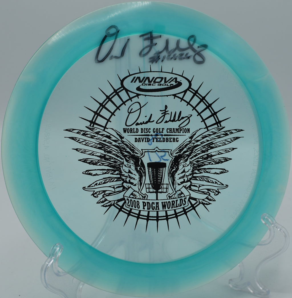 Champion Boss achieving consistent distance in windy conditions at DeLaveaga Disc Golf Course, California.