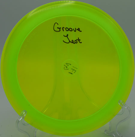 Champion Groove disc gliding smoothly on long-distance drives at Blue Ribbon Pines Disc Golf Course, Minnesota.