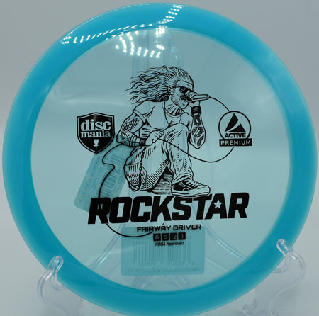 Active Premium Rockstar Discmania glide-heavy driver floating clean fairway lines at Water Works Park Disc Golf Course in Kansas City, Missouri.