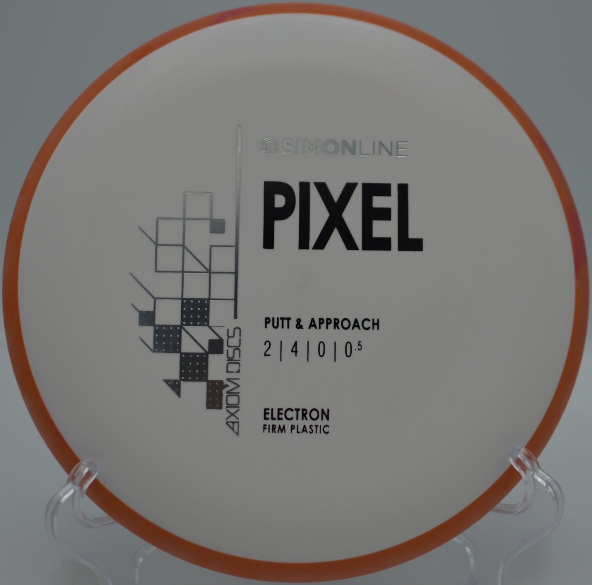 MVP Electron Firm Pixel putter parked on the putting surface after a soft landing upshot at Baldwin Park Disc Golf Course in Orlando, Florida