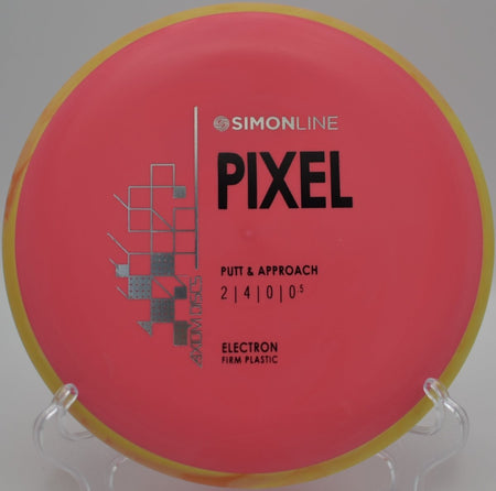 Electron Firm Pixel putter resting under basket chains after a confident putt at Stoney Hill Disc Golf Course in Lexington, South Carolina