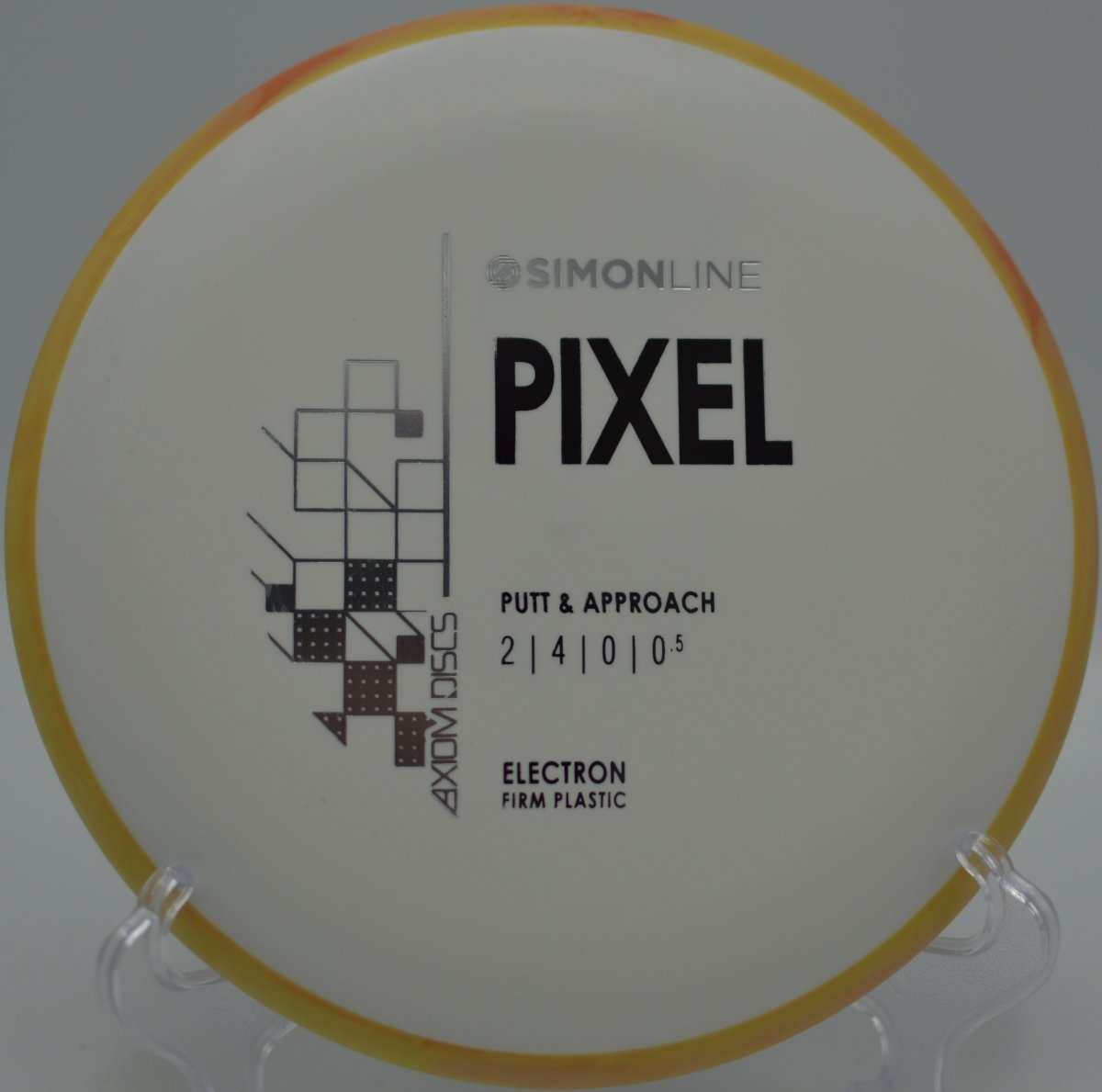 Electron Firm Pixel putter positioned for a short hyzer putt at Northwood Park Disc Golf Course in Morton, Illinois