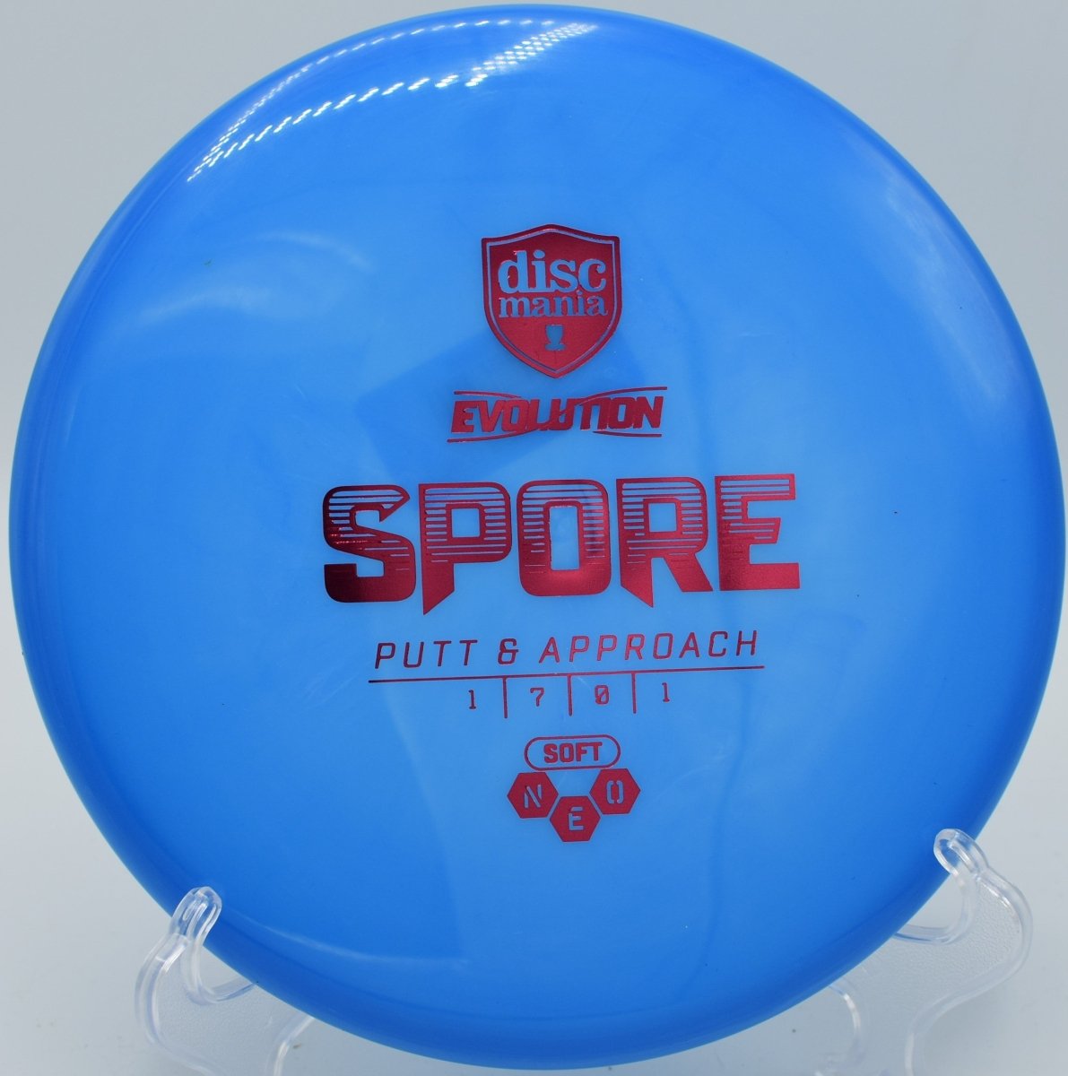 Discmania Neo Spore catch disc displayed at Maple Hill Disc Golf Course in Leicester, Massachusetts, built for warmup throws and effortless glide