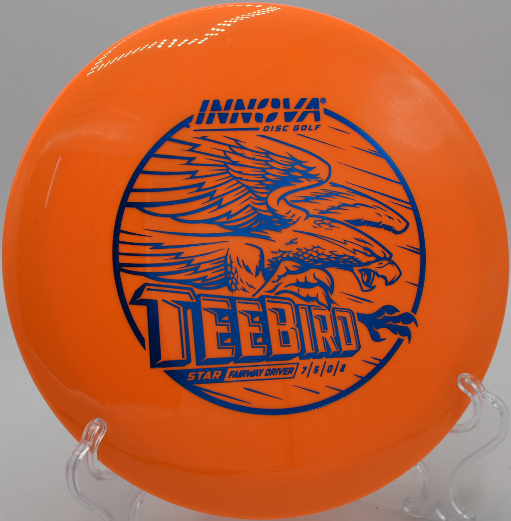 An Innova Star Teebird flying low through the tunnel fairway at Persimmon Ridge Disc Golf Course in Greenbrier, Arkansas.