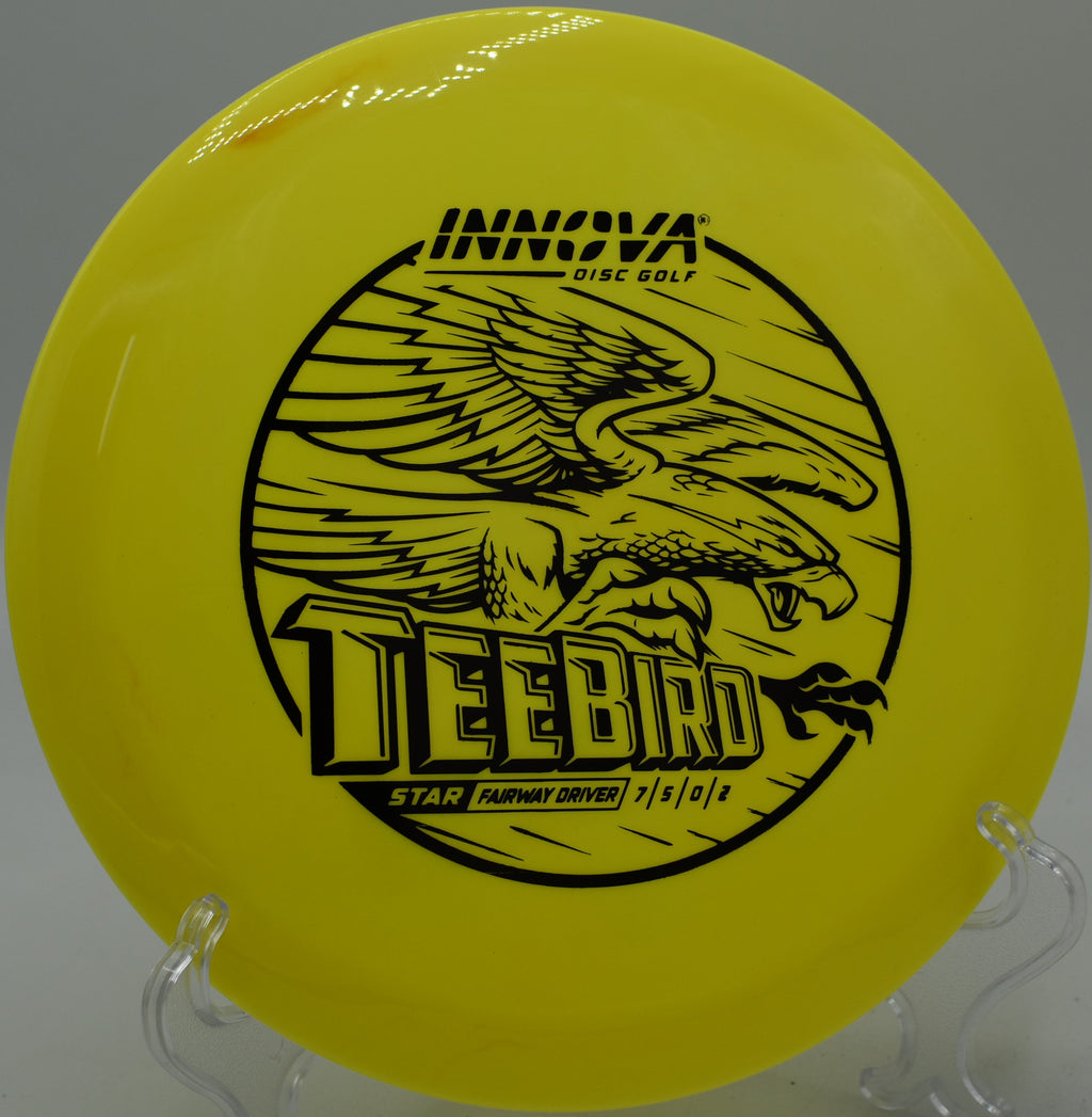 A disc golfer threading a gap with a Star Teebird at Timberlane Disc Golf Course in Gretna, Louisiana.