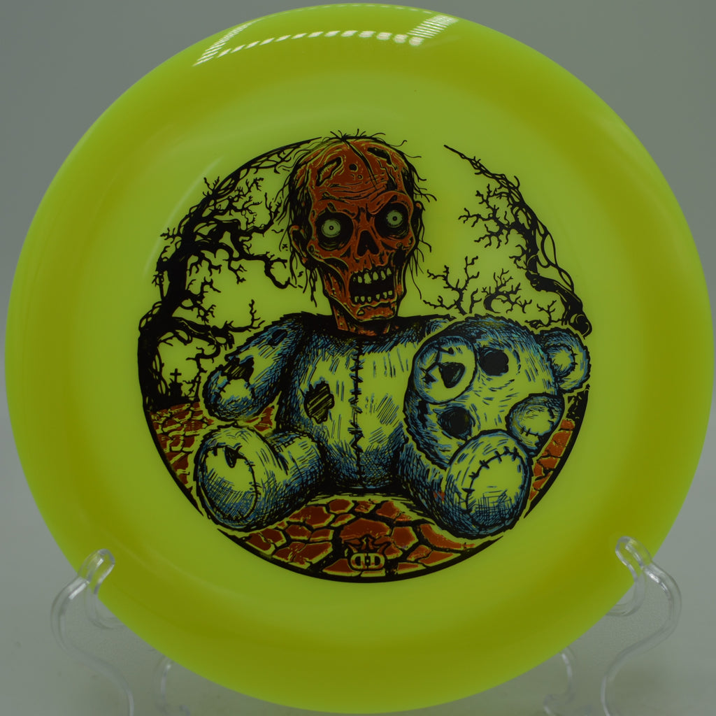 Dynamic Discs Bearly Alive Heist glow disc streaking across fairway at Beaver Ranch Disc Golf Course, CO