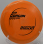 A disc golfer launching a tailwind-assisted drive with a Pro Gorgon at Shoaff Park Disc Golf Course in Fort Wayne, Indiana.