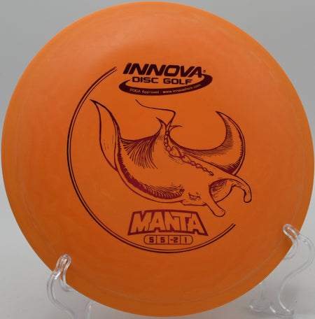 A player shaping a straight midrange drive with a DX Manta at Orange Crush Disc Golf Course in Fairmont, West Virginia.