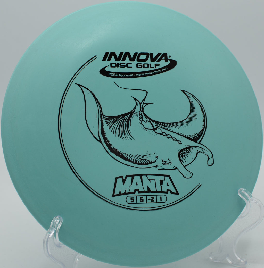 An Innova DX Manta flipping up and gliding through the woods at Big Creek Disc Golf Course in Polk City, Iowa.