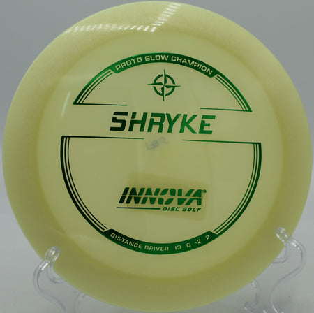 A disc golfer launching a powerful turnover shot with a Proto Glow Shryke at Blue Angel Park Disc Golf Course in Pensacola, Florida.