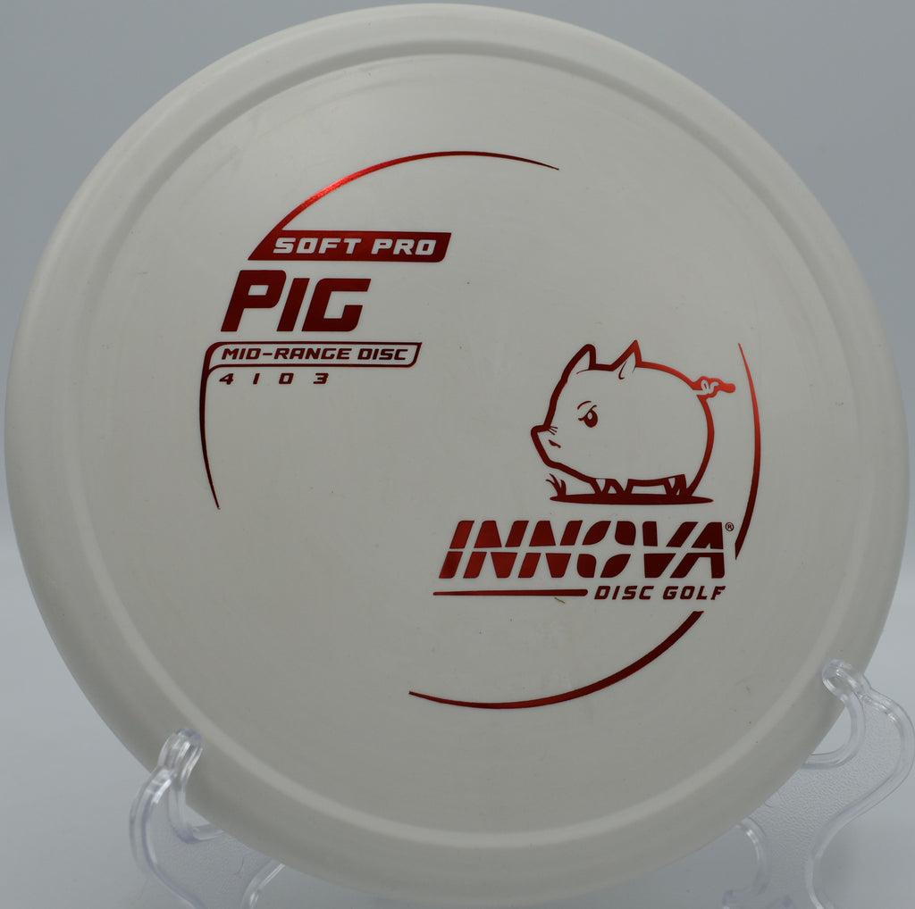 Innova Soft Pro Pig disc golf putter resting next to chains after a wind-resistant upshot at Shoaff Park in Fort Wayne, Indiana

